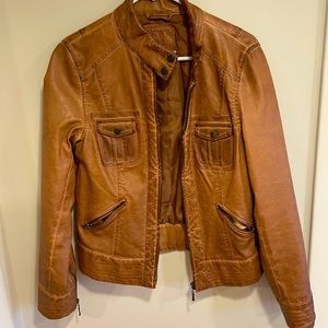 Brown jacket with zipper accents and roomy pockets